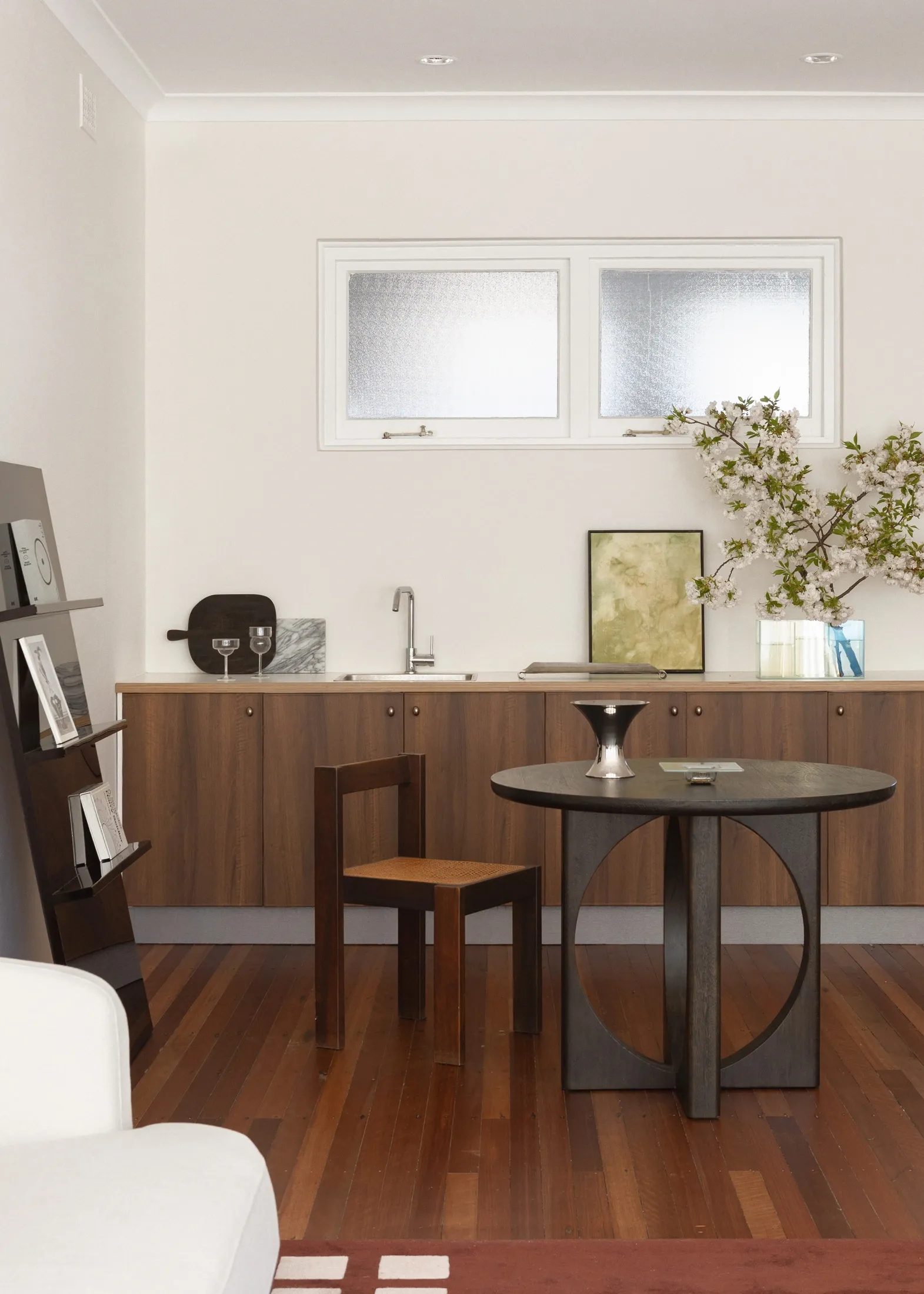 A dining area with collected wooden furniture